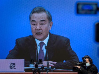 BEIJING, CHINA - MARCH 07: China's Foreign Minister Wang Yi, on screen, answers a question during a video news conference, held remotely as a precaution for COVID-19, as part of the National People's Congress on March 7, 2021 in Beijing, China.The annual political gatherings of the National Peoples Congress and …