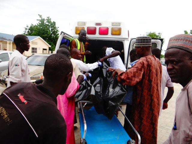 A victim is brought to the State Specialist Hospital in Maiduguri, northeastern Nigeria on July 29, 2017 the day after two suicide bombers struck a camp for displaced people in Dikwa, 90 kilometres (56 miles) east of Maiduguri, killing five. Civilian militia member Babakura Kolo said the attackers disguised themselves …