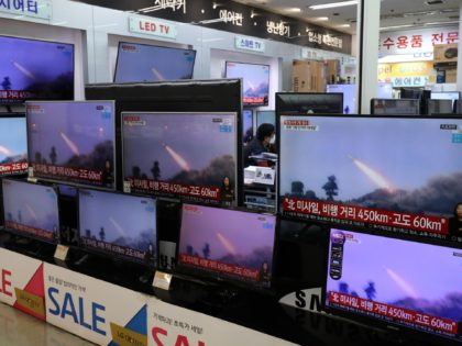 SEOUL, SOUTH KOREA - MARCH 25: A man wearing a face mask sits near TV screens showing a news program reporting about North Korea's missiles with file images at an electronic shop on March 25, 2021 in Seoul, South Korea. North Korea fired what appeared to be two short-range ballistic …