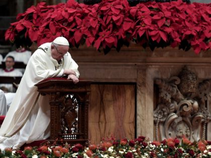 TOPSHOT - Pope Francis kneels down to pray as he celebrates mass on Christmas eve marking the birth of Jesus Christ on December 24, 2018 at St Peter's basilica in Vatican. (Photo by Tiziana FABI / AFP) (Photo credit should read TIZIANA FABI/AFP via Getty Images)