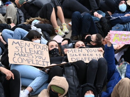 Protesters calling for greater public safety for women after the death of Sarah Everard, against the police handling of a gathering on Clapham Common in Sarah Everard's honour and against a proposed law that would give police more powers to intervene on protests hold placards as they lie down in …
