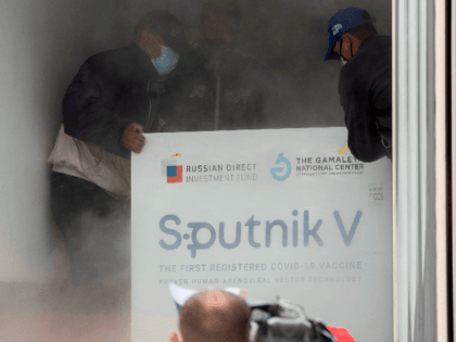 Venezuelan airport workers place in a refrigerated truck packages containing 100,000 doses of the Russian Sputnik V vaccine against the COVID-19 virus at the Simon Bolivar international airport in La Guaira, Venezuela on February 13, 2021. (Photo by Yuri CORTEZ / AFP) (Photo by YURI CORTEZ/AFP via Getty Images)