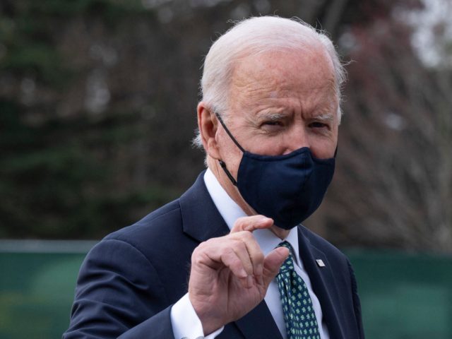 US President Joe Biden gestures as he walks off Marine One upon his arrival at the White House in Washington, DC, on March 17, 2021. (Photo by JIM WATSON / AFP) (Photo by JIM WATSON/AFP via Getty Images)
