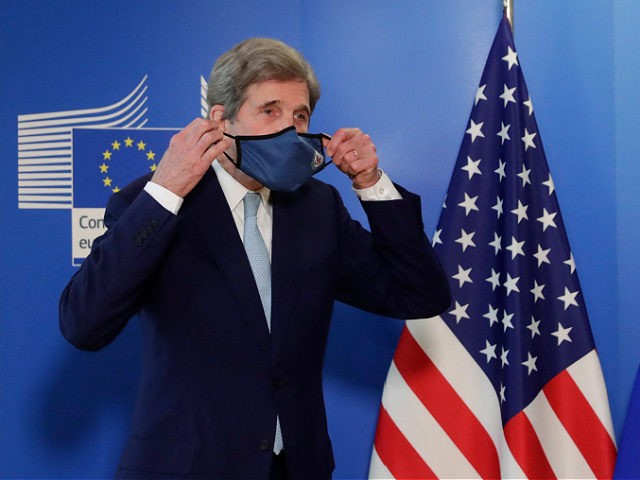 US Special Presidential Envoy for Climate John Kerry poses for a photograph after a meeting in Brussels, on March 9, 2021. (Photo by Olivier HOSLET / POOL / AFP) (Photo by OLIVIER HOSLET/POOL/AFP via Getty Images)