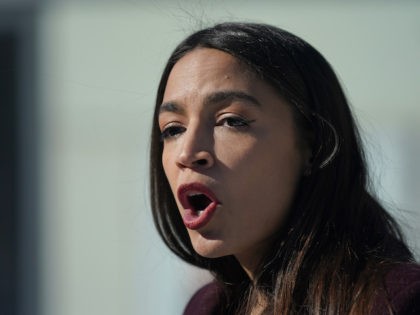 Rep. Alexandria Ocasio-Cortez speaks during a news conference in the Queens borough of New York, Monday, Feb. 8, 2021. Ocasio-Cortez was talking about a federal program that will help families pay for funeral costs during the economic downturn caused by the pandemic. (AP Photo/Seth Wenig)