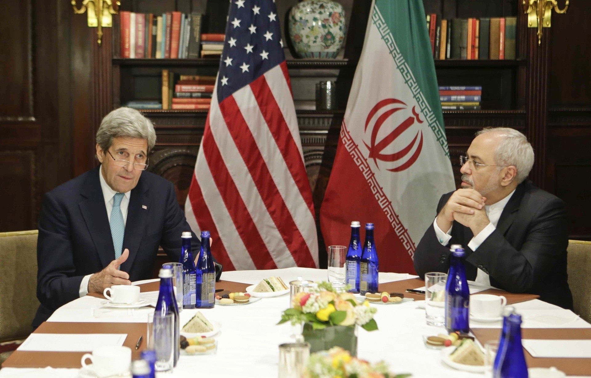 In this April 22, 2016 photo, then-Secretary of State John Kerry speaks to the media as Iranian Foreign Minister Mohammad Javad Zarif listens, in New York. (AP Photo/Frank Franklin II)