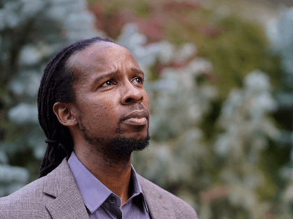 Ibram X. Kendi, director of Boston University's Center for Antiracist Research, stands for a portrait Wednesday, Oct. 21, 2020, in Boston. (AP Photo/Steven Senne)