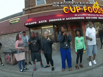 This May 25, 2020, file image from a police body camera shows Genevieve Hansen, fourth from right filming, Darnella Frazier, third from right filming, as former Minneapolis police officer Derek Chauvin was recorded pressing his knee on George Floyd's neck for several minutes in Minneapolis.
