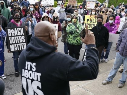 People gather for a demonstration, Thursday, April 22, 2021, in Elizabeth City, N.C., protesting the shooting of Andrew Brown Jr., 42, by a deputy sheriff trying to serve a search warrant. (AP Photo/Gerry Broome)