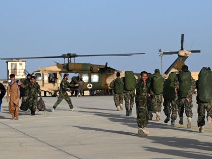 In this photograph taken on March 25, 2021 Afghan (ANA) soldiers walks towards an Afghan A
