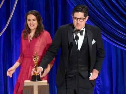 LOS ANGELES, CALIFORNIA – APRIL 25: (EDITORIAL USE ONLY) In this handout photo provided by A.M.P.A.S., (L-R) Alice Doyard and Anthony Giacchino accept the Documentary (Short Subject) award for 'Colette' onstage during the 93rd Annual Academy Awards at Union Station on April 25, 2021 in Los Angeles, California. (Photo by …