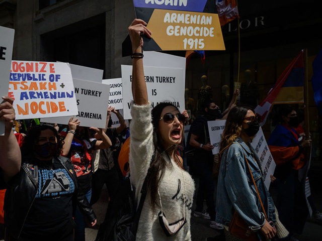 Members of New York's Armenian community hold placards and shout slogans as they march tho