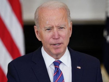 US President Joe Biden speaks about the March jobs report in the State Dining Room of the