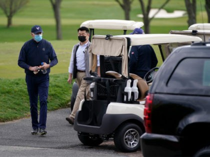 President Joe Biden walks to a motorcade vehicle after golfing at Wilmington Country Club, Saturday, April 17, 2021, in Wilmington, Del. Biden is spending the weekend at his home in Delaware. (AP Photo/Patrick Semansky)