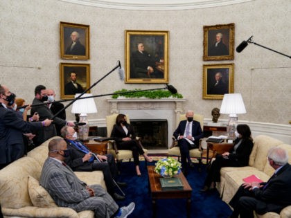 WASHINGTON, DC - APRIL 12: U.S. President Joe Biden and Vice President Kamala Harris meet with members of Congress, including Rep. Don Young (R-AK), Rep. Donald Payne Jr. (D-NJ), Sen. Roger Wicker (R-MS), Sen. Maria Cantwell (D-WA) and others in the Oval Office at the White House on April 12, …