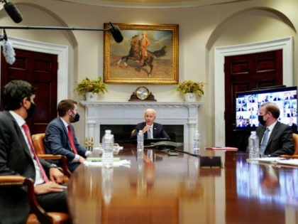 WASHINGTON, DC - APRIL 12: U.S. President Joe Biden (C) joins a CEO Summit on Semiconductor and Supply Chain Resilience via video conference with National Security Advisor Jake Sullivan (R), National Economic Council Director Brian Deese and others from the Roosevelt Room at the White House on April 12, 2021 …
