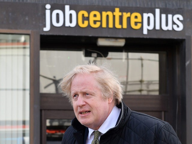 TRURO, ENGLAND - APRIL 07: British Prime Minister Boris Johnson walks past a Job Centre Pl