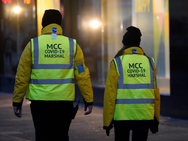 MANCHESTER, ENGLAND - DECEMBER 31: Manchester City Council Covid-19 Marshals patrol the ci