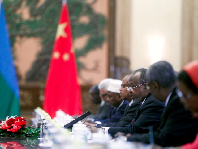 Djibouti's President Ismail Omar Guelleh, third from right, talks to Chinese counterpart Hu Jintao, unseen, following a welcoming ceremony at the Great Hall of the People in Beijing Wednesday, July 18, 2012. Guelleh is in Beijing to attend the opening ceremony of the fifth Ministerial Meeting of the Forum on …