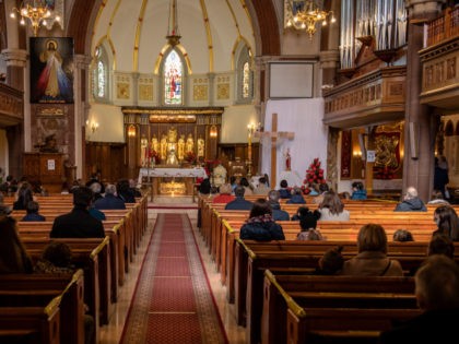 LONDON, ENGLAND - APRIL 04: Christians sit apart socially distanced during an Easter Sunday service at Christ the King church on April 4, 2021 in the Balham area of London, England. The church had its Good Friday service interrupted by police who said the church had violated Covid-19 rules on …