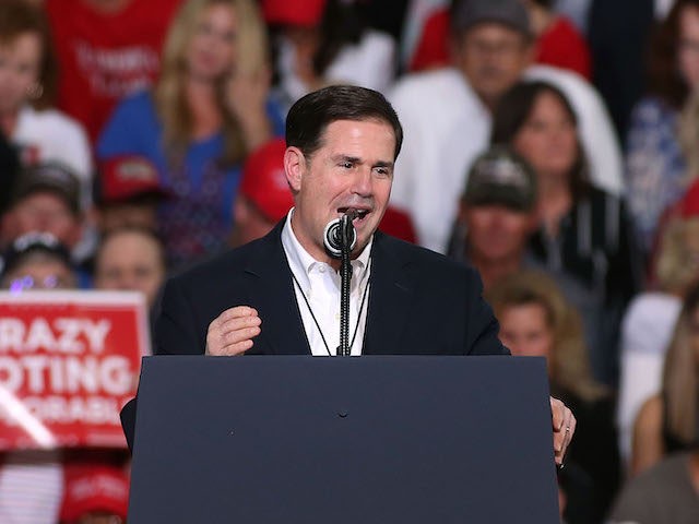 Arizona Gov. Doug Ducey speaks during a rally for President Donald Trump at the International Air Response facility on October 19, 2018 in Mesa, Arizona. (Photo by Ralph Freso/Getty Images)