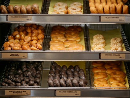 This Thursday, July 28, 2016, photo shows donuts for sale at a Dunkin' Donuts in Edmond, Okla. Dunkin' Brands Group, Inc. reports earnings, Thursday, May 4, 2017. (AP Photo/Sue Ogrocki)