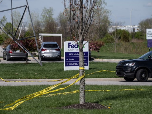 INDIANAPOLIS, IN - APRIL 16: A tree wrapped in caution tape is seen near the parking lot of a FedEx SmartPost on April 16, 2021 in Indianapolis, Indiana. The area is the scene of a mass shooting at FedEx Ground Facility that left at least eight people dead and five …