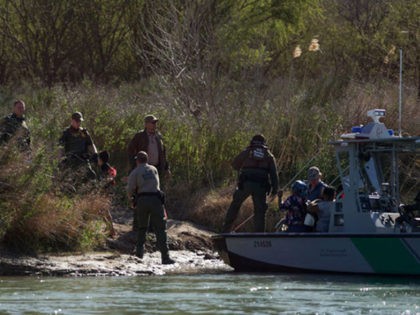 Central American migrants are taken into custody after being detained by members of the U.S. Border Patrol during their attempt to cross the Rio Bravo from Piedras Negras, in Coahuila state, Mexico to Eagle Pass, in Texas, as seen from Piedras Negras on February 17, 2019. - Last week Trump …