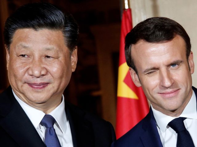 TOPSHOT - French President Emmanuel Macron (R) shakes hand with China's President Xi Jinping as they arrive at the Villa Kerylos before a dinner on March 24, 2019 in Beaulieu-sur-Mer, near Nice on the French riviera. (Photo by JEAN-PAUL PELISSIER / POOL / AFP) (Photo credit should read JEAN-PAUL PELISSIER/AFP …