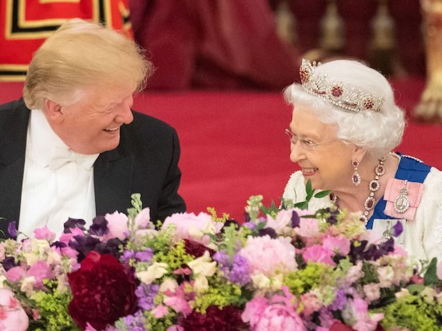 Britain's Queen Elizabeth II (R) laughs with US President Donald Trump during a State Banquet in the ballroom at Buckingham Palace in central London on June 3, 2019, on the first day of the US president and First Lady's three-day State Visit to the UK. - Britain rolled out the …