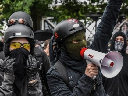 PORTLAND, OR - AUGUST 17: Counter-protesters wear black clothes during an Antifa gathering