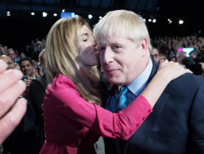 MANCHESTER, ENGLAND - OCTOBER 02: Prime Minister Boris Johnson exits the hall with his girlfriend Carrie Symonds following his keynote speech on day four of the 2019 Conservative Party Conference at Manchester Central on October 2, 2019 in Manchester, England. The U.K. government prepares to formally submit its finalised Brexit …