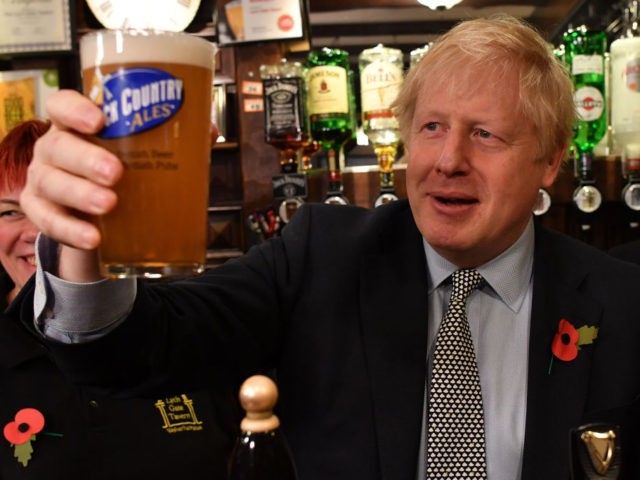 WOLVERHAMPTON, UNITED KINGDOM - NOVEMBER 11: British Prime Minister Boris Johnson raises a