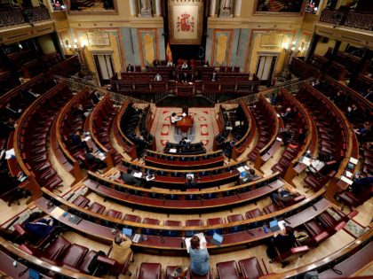 Spanish Prime Minister Pedro Sanchez (C) delivers a speech during a session to debate the extension of a national lockdown to curb the spread of the novel coronavirus at the Lower Chamber of the Spanish parliament in Madrid on May 6, 2020. - Spain's coalition government has warned the opposition …