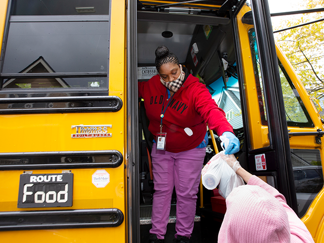 Nutritionist Shaunté Fields delivers meals to children and their families on May 6, 2020 in Seattle, Washington. Since the outbreak of COVID-19 and the closure of all school buildings, the Seattle Public Schools Nutrition Services Department has been distributing breakfast and lunch to students through a network of 26 school …