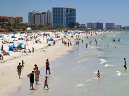 CLEARWATER, FL - MAY 04: People visit Clearwater Beach after Governor Ron DeSantis opened the beaches at 7am on May 04, 2020 in Clearwater, Florida. Restaurants, retailers, beaches and some state parks reopen today with caveats, as the state continues to ease restrictions put in place to contain COVID-19. (Photo …