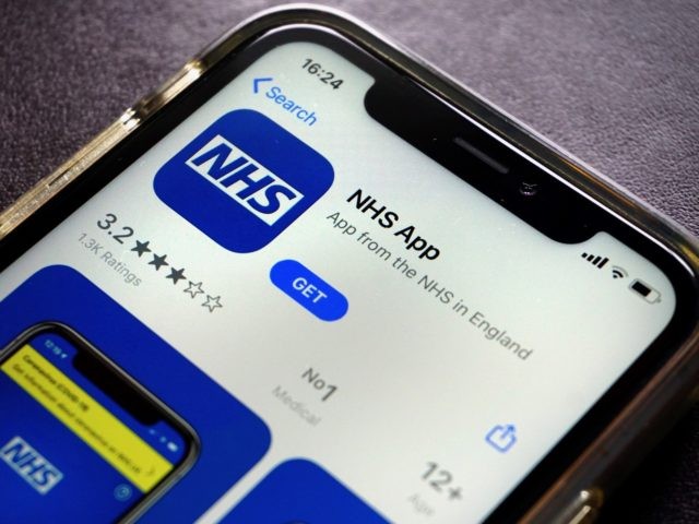 A photograph arranged as an illustration in Hartley Wintney, west of London on August 19, 2020 shows the NHS app, for Britain's NHS (National Health Service) on a smart phone. (Photo by ADRIAN DENNIS / AFP) (Photo by ADRIAN DENNIS/AFP via Getty Images)