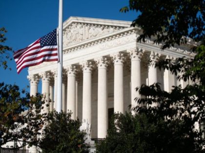 The American flag flies at half staff for late US Supreme Court Justice Ruth Bader Ginsburg outside the US Supreme Court in Washington, DC, September 21, 2020. - Ruth Bader Ginsburg will lie in repose at the Supreme Court on September 23 and September 24, 2020, before lying in state …