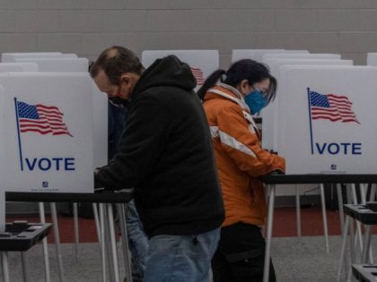 TOPSHOT - Residents cast their votes on November 3, 2020, at Mott Community College in Fli