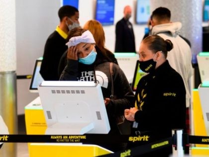 A passenger checks in for a Spirit Airlines flight at Los Angeles International Airport ah