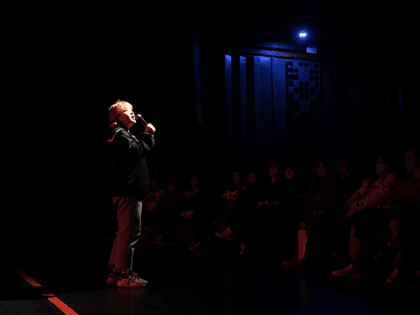 This photo taken on November 21, 2020 shows stand-up comedian Qiqi performing at a theatre in Beijing. - A new wave of young, female stand-up acts in China has crashed into what has always previously been a man's world, and benefiting from a surge of interest in stand-up in China …