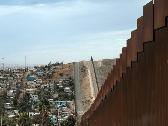 A reinforced section of the US-Mexico border fencing seen at El Nido de las Aguilas eastern Tijuana, Baja California state, Mexico on January 20, 2021. - Mexican President Andres Manuel Lopez Obrador said Wednesday that he shared Joe Biden's policy priorities and wished him success ahead of his inauguration. (Photo …