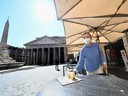Staff of a coffe-restaurant, brings coffees for customers, in Piazza della Rotonda at the Pantheon, in central Rome, on March 15, 2021, as three-quarters of Italians entered a strict lockdown as the government put in place restrictive measures to fight the rise of COVID-19 infections. (Photo by Andreas SOLARO / …