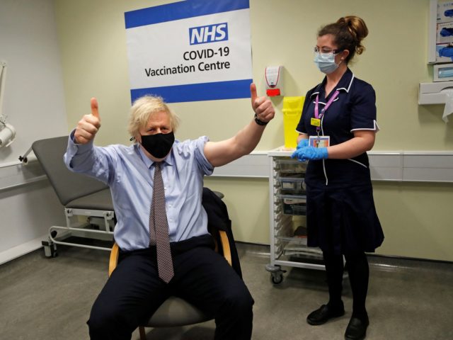 Britain's Prime Minister Boris Johnson reacts after he received a dose of a AstraZeneca/Oxford Covid-19 vaccine, administered by nurse and Clinical Pod Lead, Lily Harrington, at the vaccination centre in St Thomas' Hospital in London on March 19, 2021. - British Prime Minister Boris Johnson said on Wednesday he will …