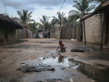 TOPSHOT - A child plays in one of the alleys of the port of Paquitequete near Pemba on March 29, 2021. Sailing boats are expected to arrive with people displaced from the coasts of Palma and Afungi after suffering attacks by armed groups since last March 24. - Dozens of …
