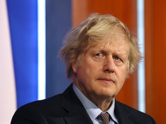 Britain's Prime Minister Boris Johnson gives an update on the coronavirus Covid-19 pandemic during a virtual press conference inside the new Downing Street Briefing Room in central London on March 29, 2021. - England entered the second phase of its lockdown easing on Monday thanks to a successful vaccination drive, …