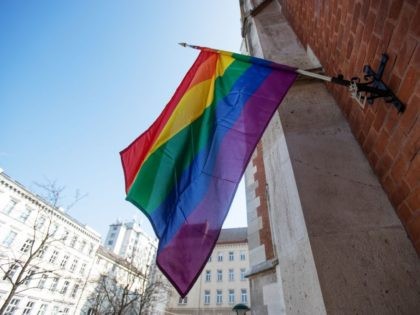 A LGBT rainbow flag hangs outside St Elizabeth Church in Wieden, Vienna, on March 25, 2021. - As a protest against the decision of the Vatican Congregation for the Doctrine of the Faith to bless homosexual partnerships, two Viennese churches display the rainbow flag. - TO GO WITH AFP STORY …