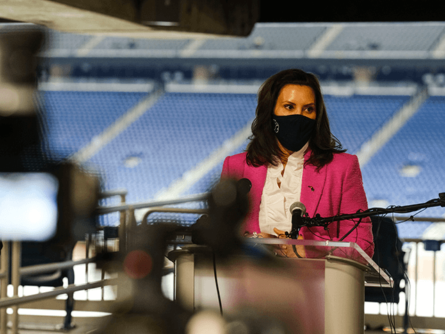 Michigan Governor Gretchen Whitmer speaks to members of the press about the rising numbers of Covid-19 cases in Michigan and the vaccine availability before receiving a dose of the Pfizer Covid vaccine at Ford Field on April 6, 2021 in Detroit, Michigan. As the US reaches a milestone in vaccinations, a surge of new Covid-19 cases has swept through the US with Michigan seeing the highest numbers of new cases. (Photo by Matthew Hatcher/Getty Images)