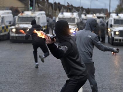 BELFAST, NORTHERN IRELAND - APRIL 08: Nationalists attack Police on Springfield Road just up from Peace Wall interface gates which divide the nationalist and loyalist communities on April 8, 2021 in Belfast, Northern Ireland. Trouble has flared for a second night running in the Springfield Road area of Belfast. US …