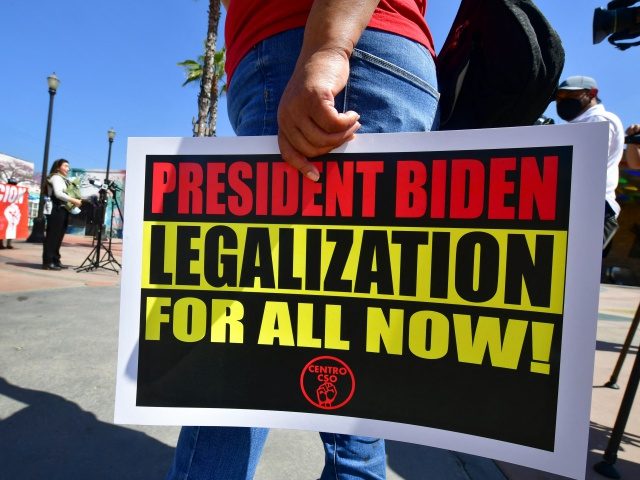Immigrant families and their supporters attend a rally at Mariachi Plaza in Los Angeles, California on April 8, 2021, demanding President Joe Biden move forward with his plan to grant legal status to the more than 10 million undocumented immigrants as well as calling for the release of children being …